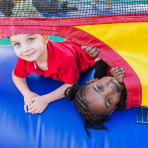 young children playing in bounce house